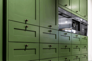 A wall of green cabinets.