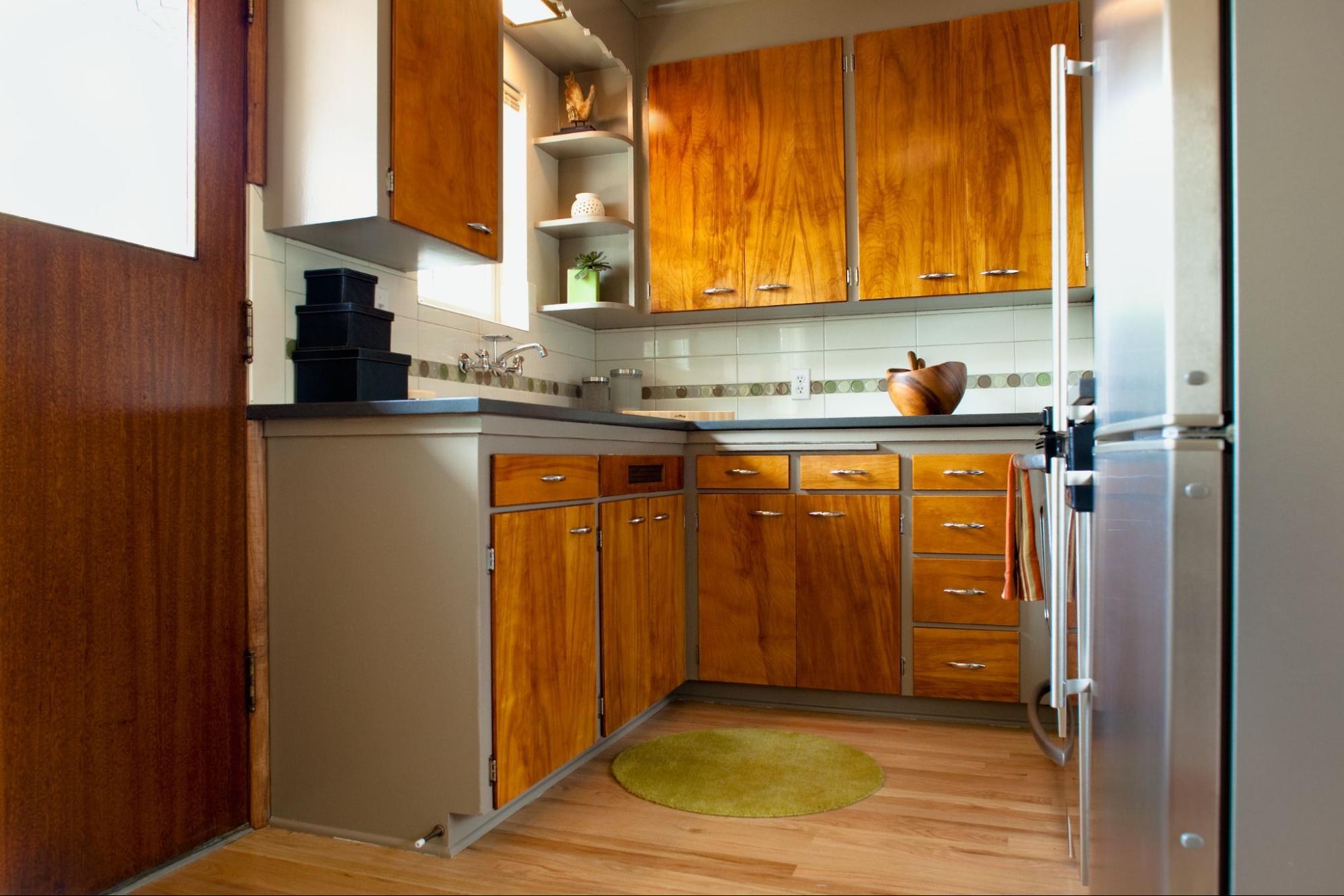 Kitchen with lightly-stained wooden cabinets