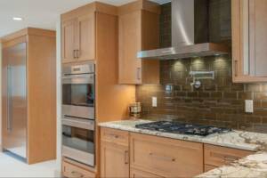 A modern kitchen with wooden cabinets.